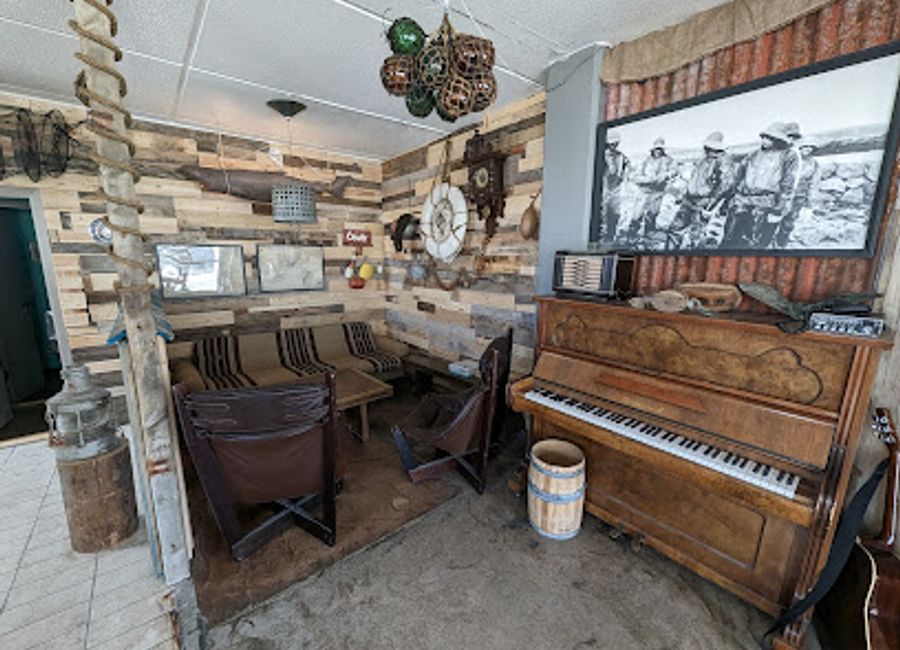 Discover the warmth of Icelandic hospitality at Verbudin, Bolungarvik's cozy bar, offering a delightful selection of local and international beverages.