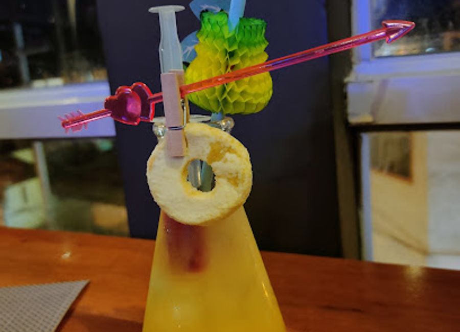 Experience the breathtaking views and vibrant atmosphere at El Alquimista Rooftop Bar in Huaraz, a perfect end to your adventurous day.