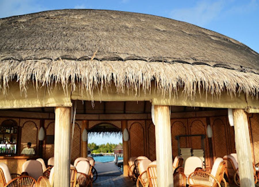 Experience the ultimate relaxation at Sunset Bar Angaga Resort, where breathtaking sunsets and tropical drinks create unforgettable moments.