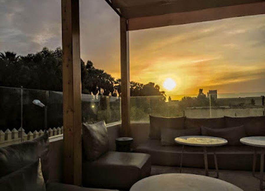 Experience the vibrant rooftop lounge in Fes, where stunning views meet delectable cuisine, creating the perfect escape for tourists.