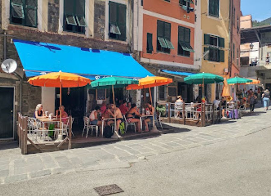 Experience the vibrant spirit of Vernazza at Blue Marlin Bar, your go-to destination for cocktails, pizza, and unforgettable coastal views.