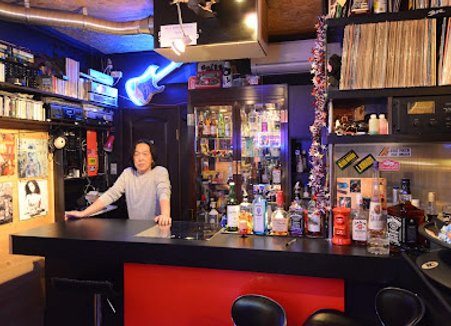 Experience the unique charm of Rock Stock, a must-visit bar in Kyoto where local culture and vibrant nightlife merge in an affordable setting.