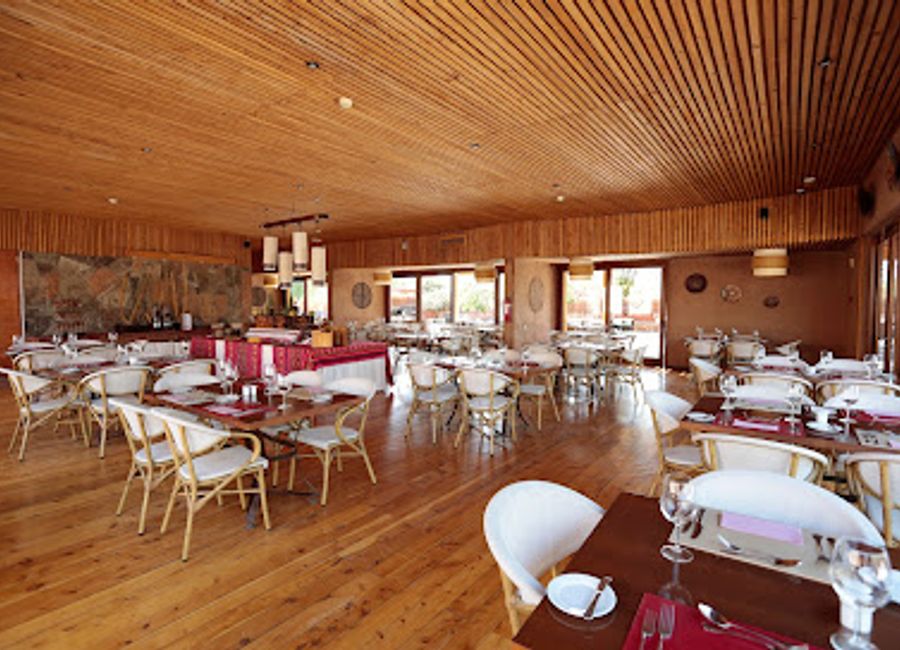 Experience the flavors of San Pedro de Atacama at Restaurant Kunza, where local ingredients meet stunning desert views for an unforgettable dining experience.