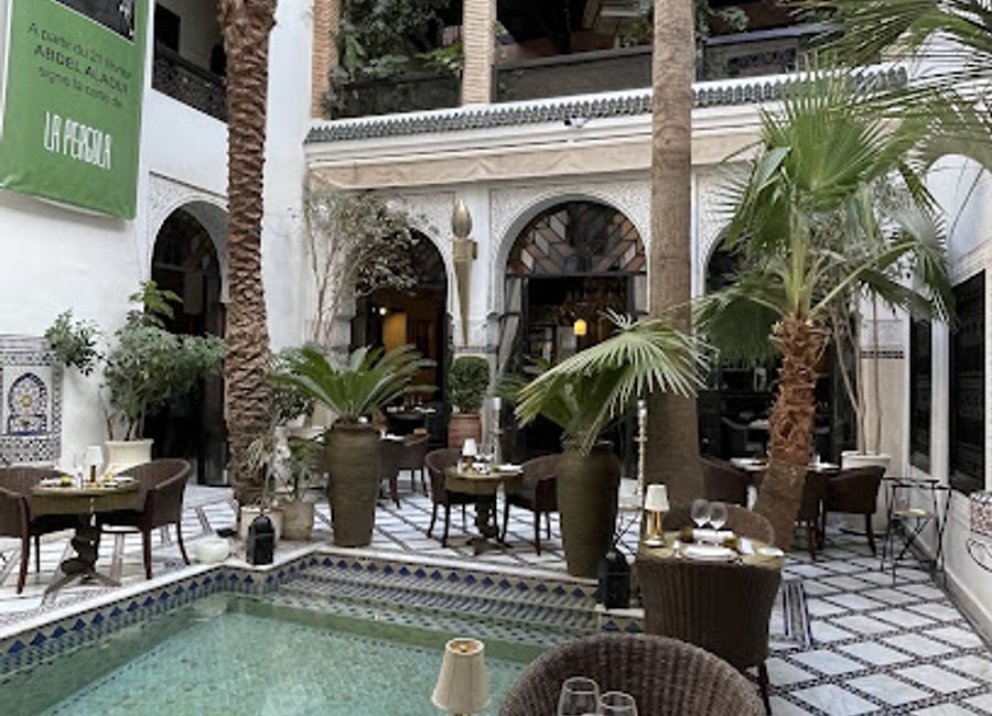 Discover La Pergola: A lively bar and restaurant in Marrakech offering Moroccan cuisine, cocktails, and live music in a vibrant atmosphere.