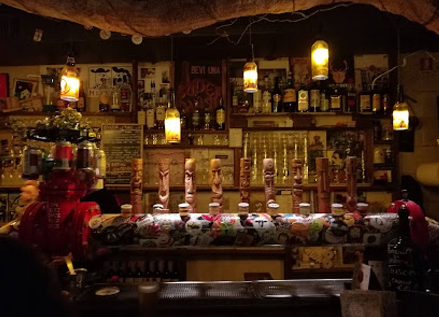 Experience the lively atmosphere and local flavors at Bastian Contrario, a vibrant pub in the heart of Parma, perfect for a night out.