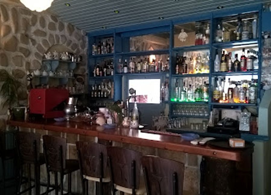 Experience the vibrant atmosphere and local flavors at Seriani Cafe Bar in Lakka, a must-visit pub for all tourists exploring the region.