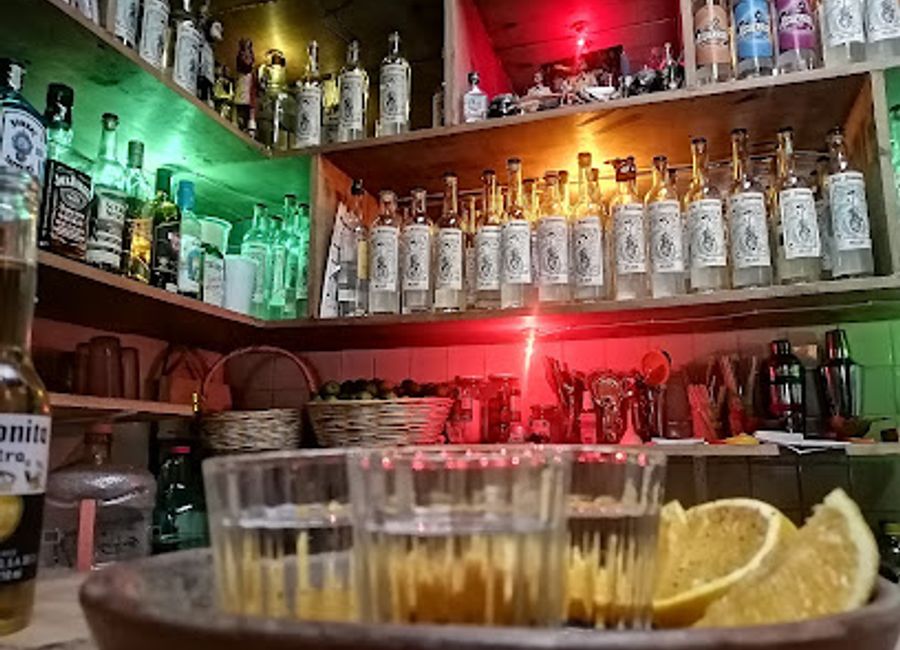 Experience the vibrant culture of San Cristóbal at Puro Mexicano Mezcalería, where mezcal meets live piano music in an inviting atmosphere.