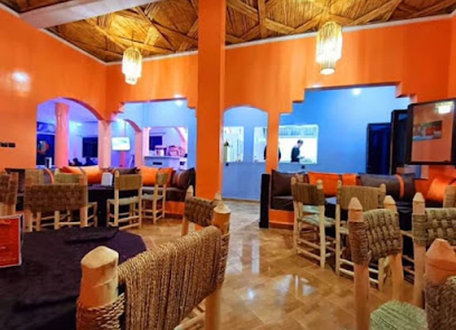 Experience the authentic taste of Morocco at Kasr Diafa Restaurant & Snack & Cafe, offering delicious grilled dishes in the heart of Merzouga.