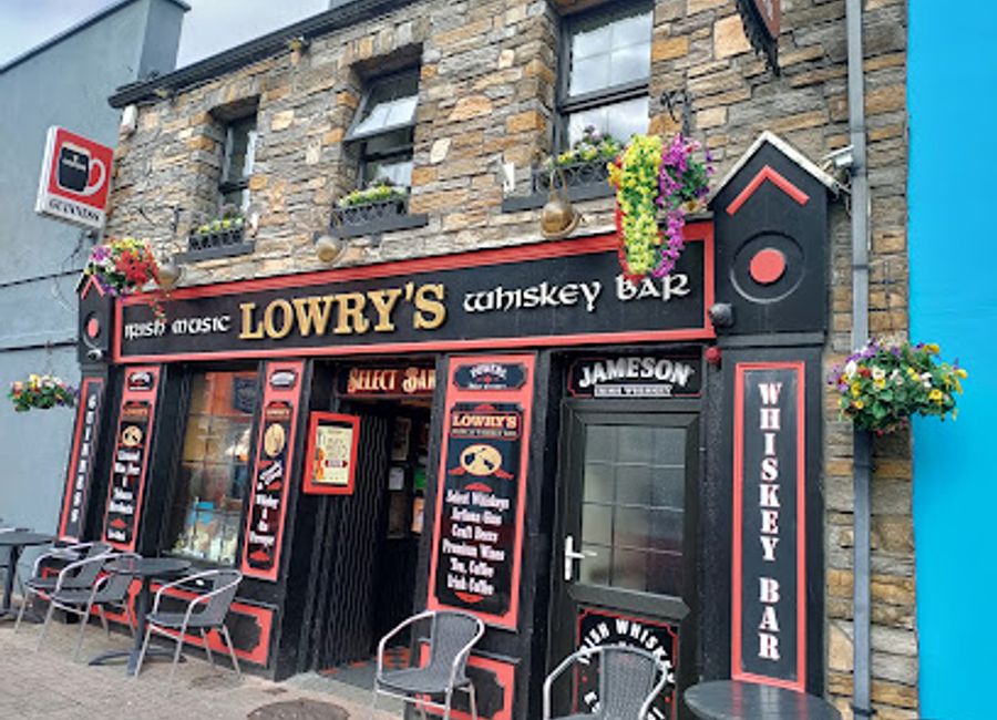 Discover the heart of Clifden at Lowry's Bar, an Irish pub blending authentic cuisine, live music, and a warm atmosphere in the stunning Galway region.