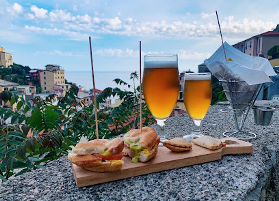 Discover the charm of Old School Cocktails & Food in Riomaggiore, where traditional cocktails meet modern culinary delights in a picturesque setting.