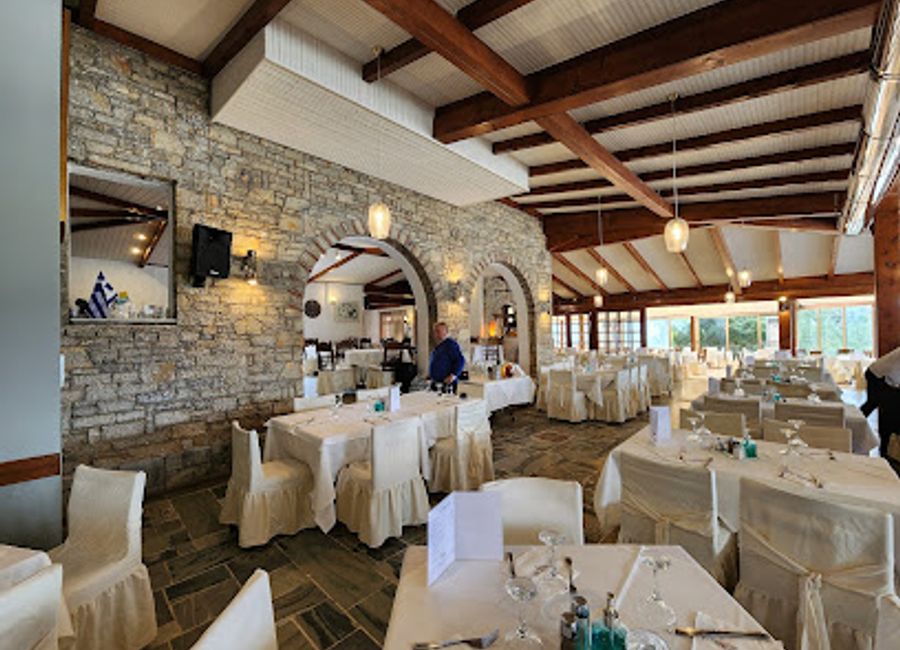 Experience authentic Greek cuisine at Villa Symposium Restaurant in Delphi, where tradition meets stunning views and warm hospitality.