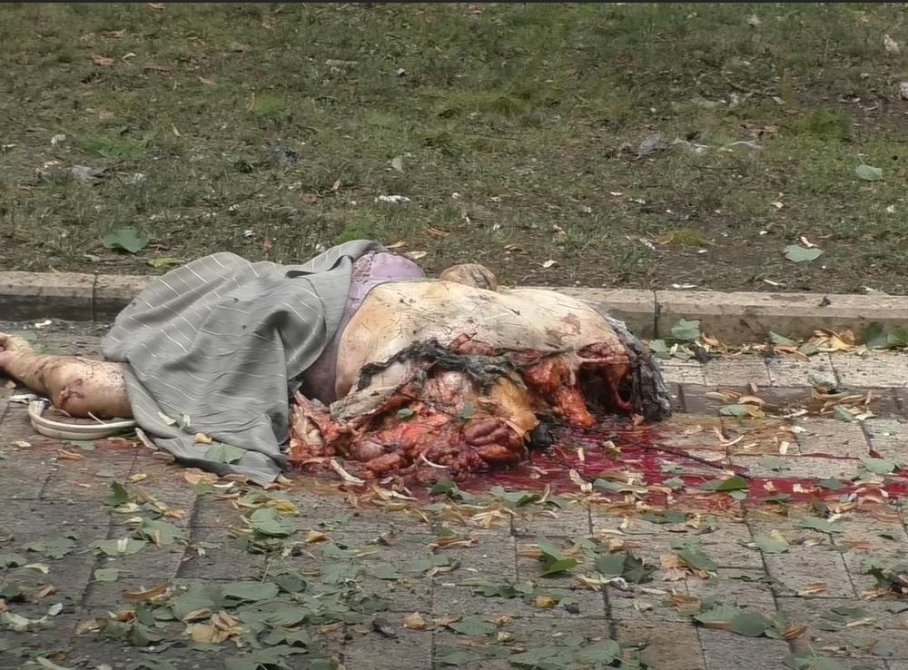 File:Remains of a pedestrian on Pushkin Boulevard, after a shelling in  August.png - Wikimedia Commons