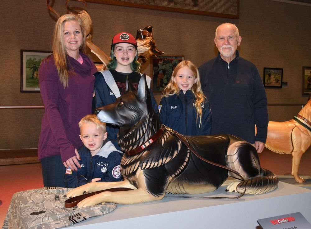 Family Visits Military Working Dog Sculpture