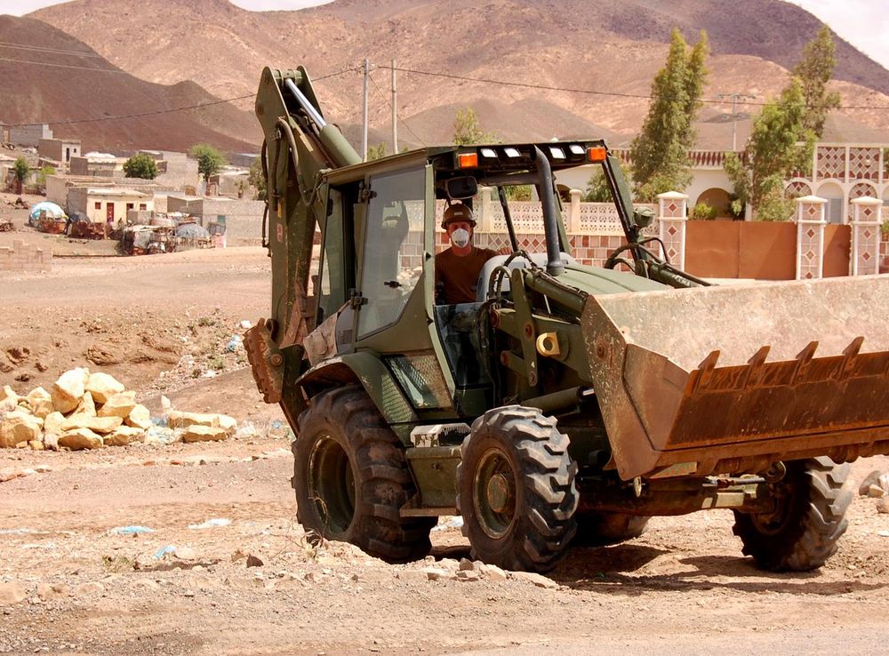 File:US Navy 090404-N-1057H-150 Equipment Operator Constructionman  Apprentice Graeme Hathaway, assigned to Naval Mobile Construction Battalion  (NMCB) 11 Detachment Horn of Africa, drives a backhoe.jpg - Wikimedia  Commons