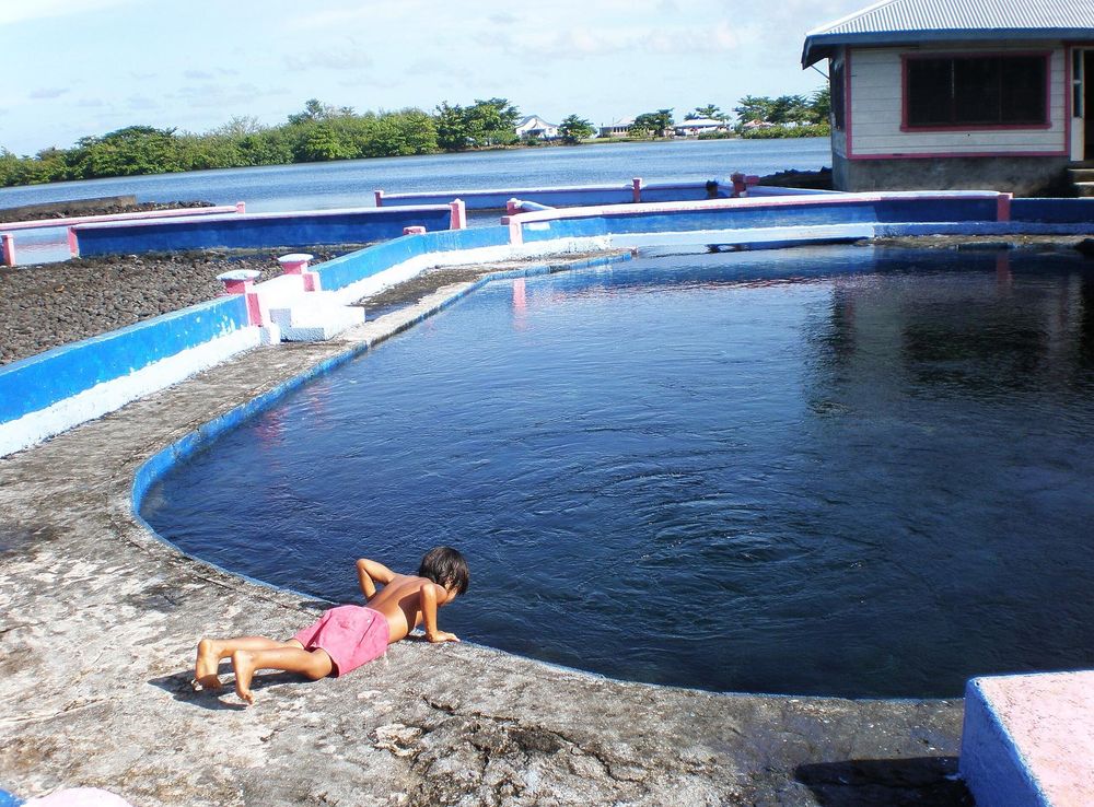File:Child leaning down to take a drink of water at the Mata o le Alelo  fresh water pool, Matavai village, Savai'i, Samoa 2009.JPG - Wikimedia  Commons