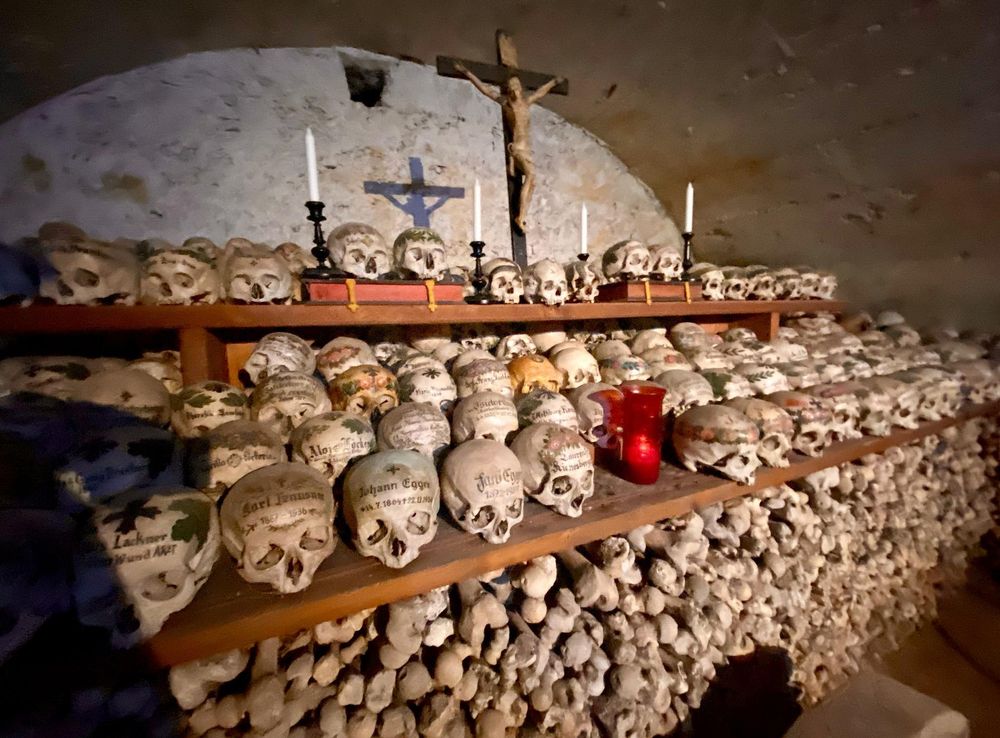 File:Respecting the dead.Painted skulls (Totenschädel) and bones. Beinhaus  ('bone house', ossuary) Roman Catholic chapel, Hallstatt, Salzkammergut,  Austria 2019.jpg - Wikipedia
