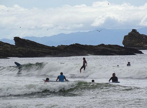 File:Surfers and Swimmers - Maderas Beach - North of San Juan del Sur -  Nicaragua (31517467740) (2).jpg - Wikimedia Commons