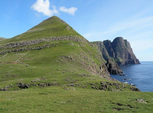 File:Lopranseiði and Kirvi a Mountain in Suðuroy and the Cliff Beinisvørð.JPG  - Wikimedia Commons