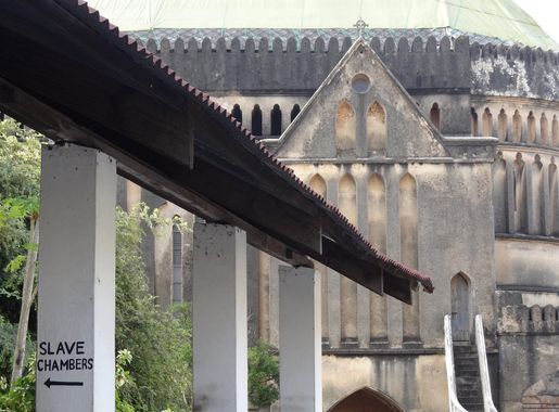File:Facade of Cathedral with Sign for Slave Chambers - Anglican  Cathedral-Old Slave Market - Stone Town - Zanzibar - Tanzania  (8841982338).jpg - Wikimedia Commons