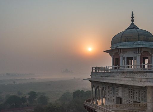 File:A view of Galleries beneath the Khas Mahal at Sunrise on a foggy day.  In the distance one can see Taj Mahal.jpg - Wikimedia Commons