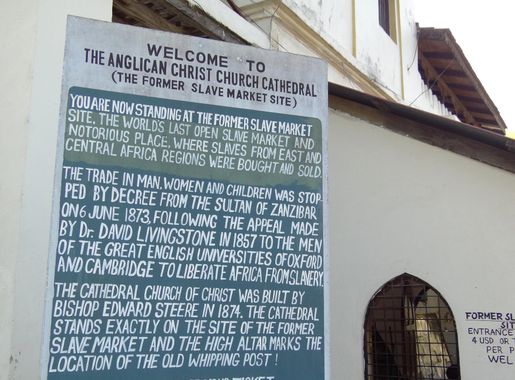 File:Sign outside Anglican Cathedral-Old Slave Market - Stone Town -  Zanzibar - Tanzania (8841973088).jpg - Wikimedia Commons