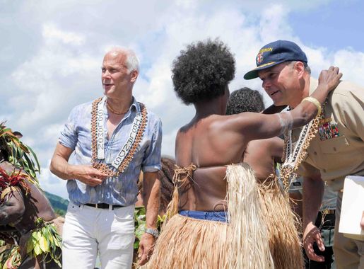 File:US Navy 090810-N-9689V-004 Capt. Andrew Cully, right, Pacific  Partnership 2009 mission commander, and Paul Berg, Charge d'Affairs for the  United States, receive gifts from Malaita Island villagers.jpg - Wikimedia  Commons