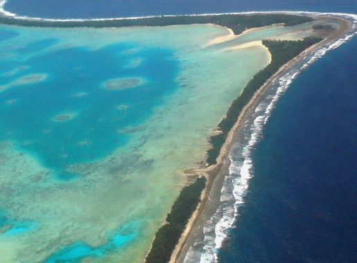 File:Aerial view of Tuvalu's capital, Funafuti, 2011. Tuvalu is a remote  country of low lying atolls, making it vulnerable to climate change. Photo-  Lily-Anne Homasi - DFAT (12779656093).jpg - Wikimedia Commons