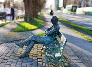 ireland/county-dublin/landmark/patrick-kavanagh-statue-1991-by-john-coll
