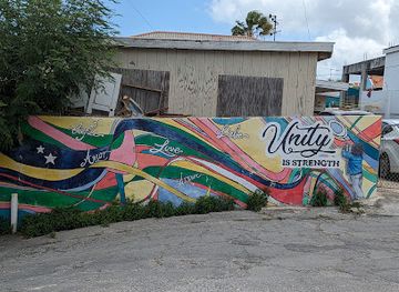 curacao/punda/landmark/unity-is-strength-wall