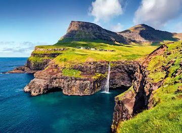 faroe-islands/miovagur/landmark/view-on-mullafossur-and-gasadalur-village