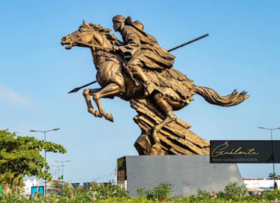 benin/cotonou/fidjrosse/landmark/statue-bio-guerra-cotonou-airport