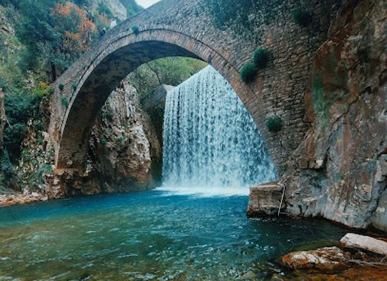 greece/thessaly/landmark/stone-bridge-and-waterfall-of-palaiokarya