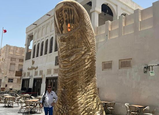 qatar/umm-salal/landmark/the-golden-thumb-statue