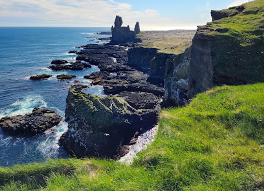 Discover the breathtaking Lóndrangar sea stacks in Iceland, a natural wonder on the Snæfellsnes Peninsula perfect for adventure and photography.