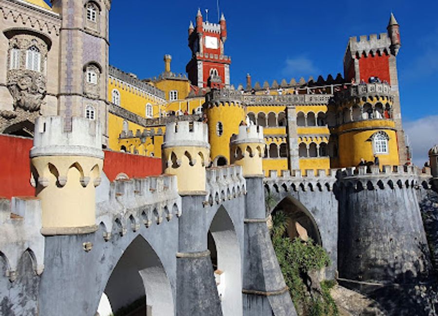 Explore the vibrant National Palace of Pena, a UNESCO World Heritage Site in Sintra, showcasing stunning architecture and breathtaking landscapes.