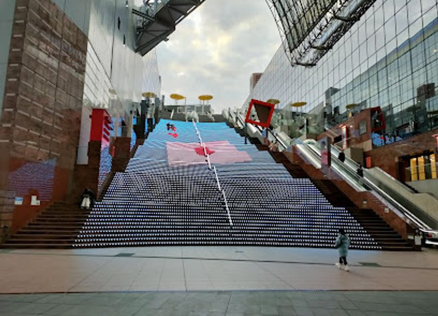 Discover the architectural beauty of Kyoto Station Daikaidan, a stunning staircase that blends modern design with traditional charm in the heart of Kyoto.