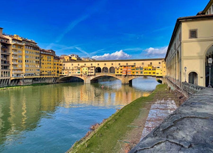 Discover the Ponte Vecchio, Florence's iconic bridge adorned with shops and rich history, offering stunning views and a vibrant atmosphere.