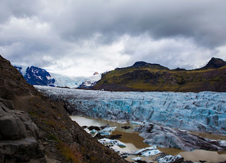 Explore the stunning Svinafellsjokull Glacier in Iceland's Vatnajokull National Park, where breathtaking ice formations meet diverse landscapes.