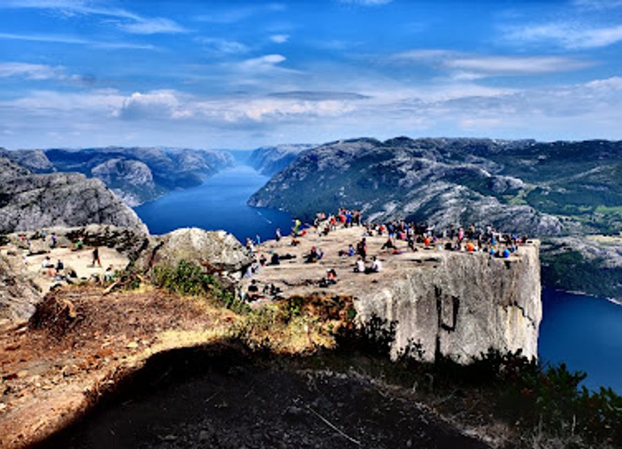 Discover Preikestolen, Norway's breathtaking cliff offering stunning views of the Lysefjord and an unforgettable hiking adventure in nature's embrace.