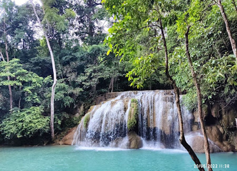 Discover Erawan Falls, a stunning multi-tiered waterfall in Kanchanaburi, Thailand, perfect for swimming, hiking, and immersing in nature's beauty.