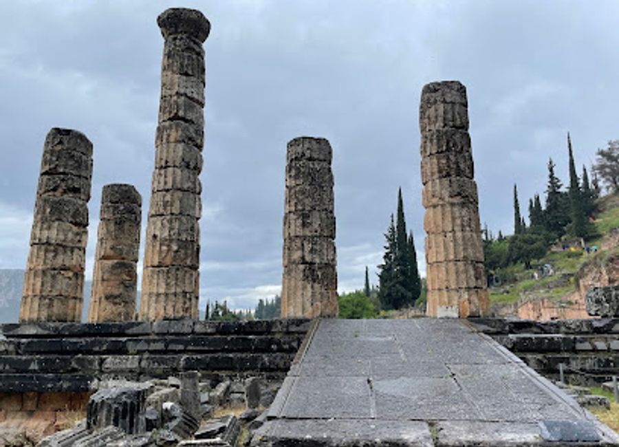 Explore the Sikyonian Treasury in Delphi, a stunning historical landmark showcasing the artistry and devotion of ancient Greece amidst breathtaking scenery.
