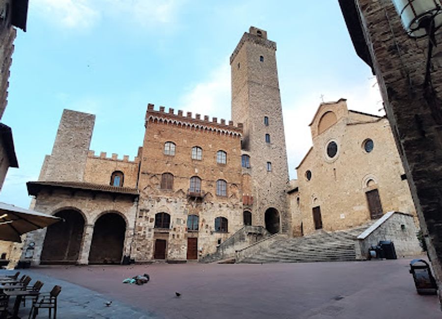 Discover the timeless beauty of San Gimignano's Palazzo Comunale, featuring exquisite art collections and stunning views from Torre Grossa.