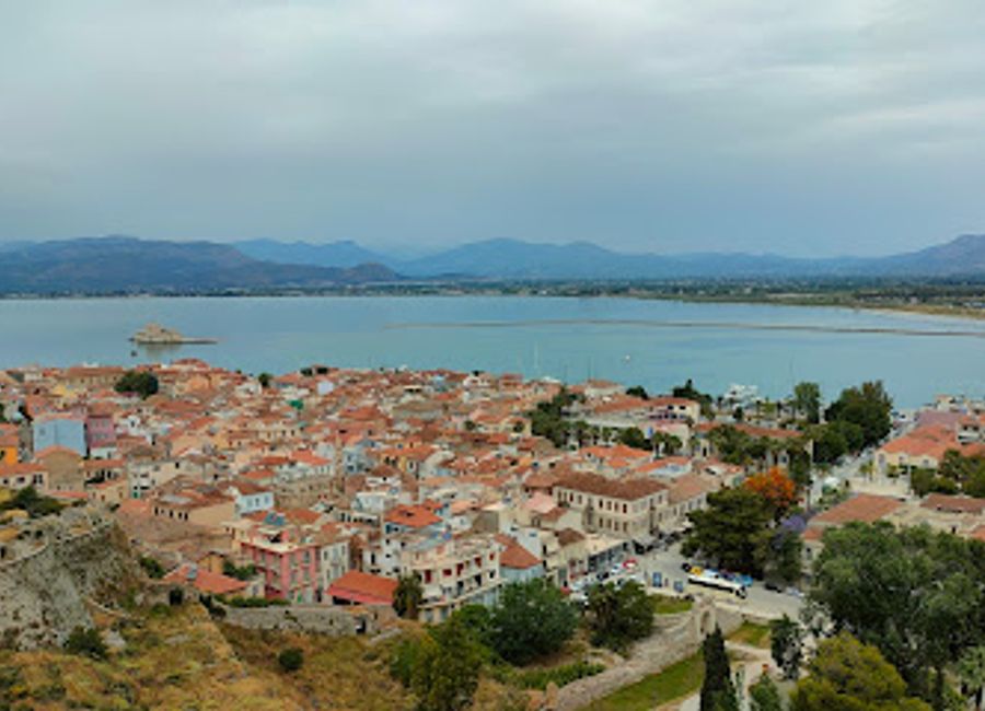 Explore the historic Syntagma Square in Nafplio, where vibrant culture and stunning architecture come together in a picturesque setting.