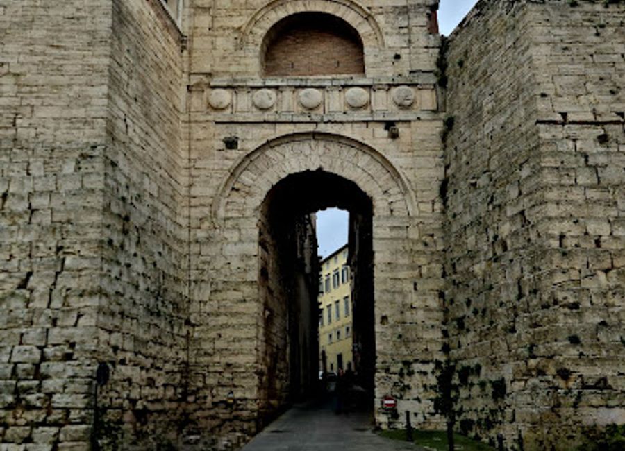 Explore the Etruscan Arch in Perugia, Italy - a captivating historical landmark connecting ancient architecture with vibrant city life.