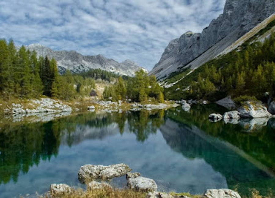 Explore Triglav, Slovenia's highest peak, and immerse yourself in the natural beauty of the Julian Alps with breathtaking views and unforgettable adventures.