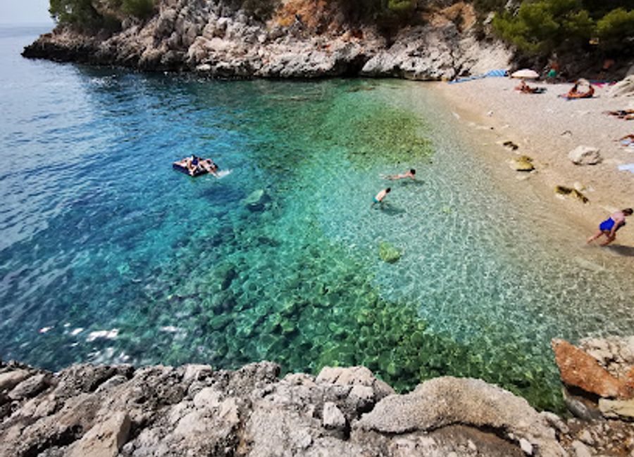 Discover Lučišća Bay: A hidden Hvar paradise with crystal waters, pebble beaches, and tranquil pine forests near Sveta Nedjelja.