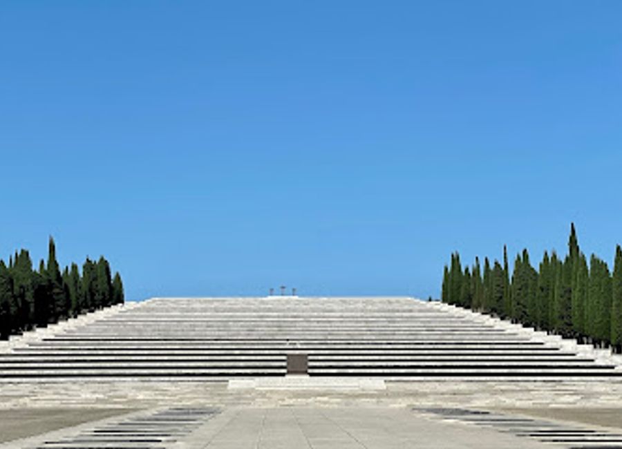 Explore the Military Memorial Redipuglia, a poignant tribute to the fallen soldiers of World War I, surrounded by serene landscapes and rich history.