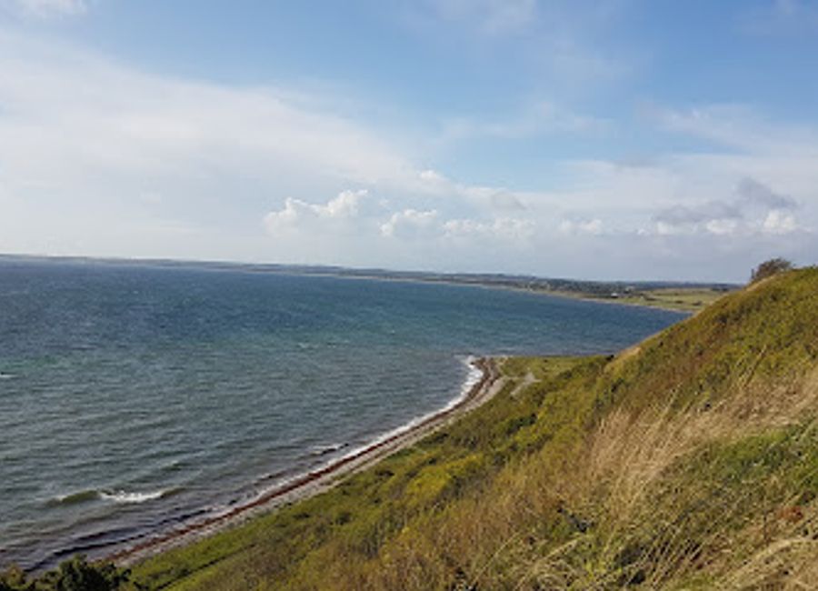 Discover Jernhatten: A scenic coastal gem in Djursland with panoramic views, rare flora, and a touch of Viking history, perfect for nature lovers and outdoor adventurers.