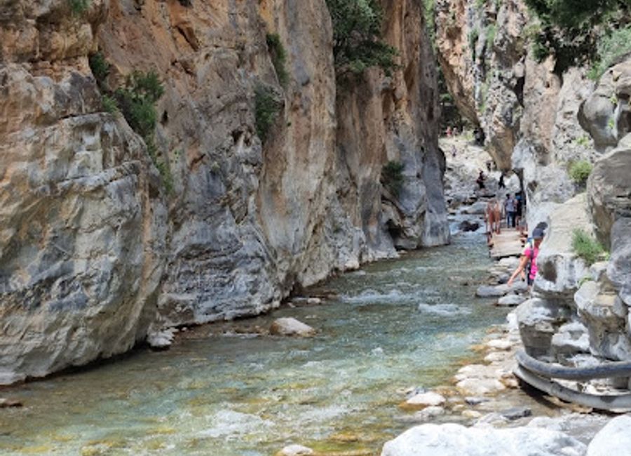 Hike through Crete's natural wonder, Samaria Gorge, and witness the awe-inspiring Iron Gates, where towering cliffs meet in a dramatic display.