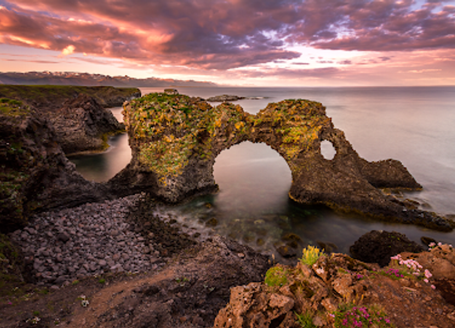 Discover Gatklettur, a breathtaking rock arch in Iceland's Snæfellsnes Peninsula, showcasing stunning landscapes and vibrant birdlife.